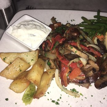 Osteria Romana - Monroe - Steak with oven roasted potatoes, veggies and mint yogurt sauce - Italian Near Me - Monroe, Connecticut Osteria Romana - Monroe - Steak with oven roasted potatoes, veggies and mint yogurt sauce - Italian Near Me - Monroe, Connecticut