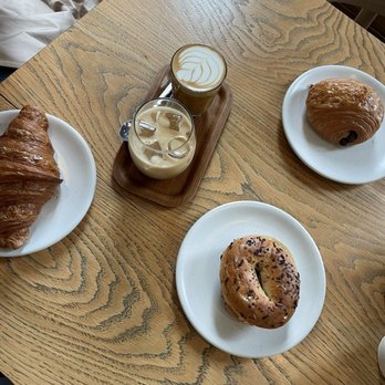 The Watch House - The bagel with smoked salmon and dill cream cheese, chocolate croissant, ham and cheese croissant, and an oat milk latte with agave - Coffee & Tea Near Me - London, XGL