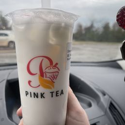a hand holding a cup of bubble tea a hand holding a cup of bubble tea