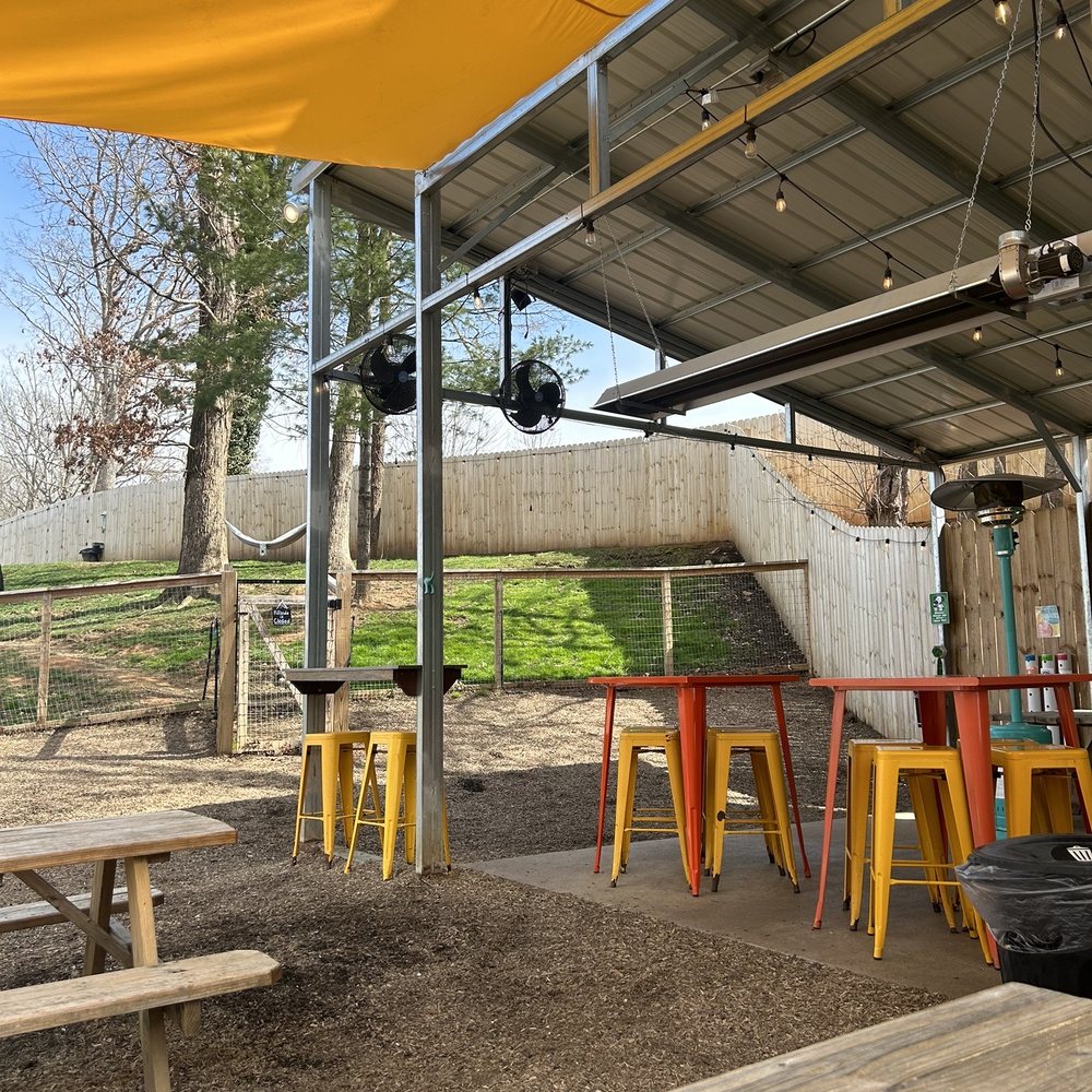 Wagbar - tables and chairs under a yellow awning - Dog Parks Near Me - Weaverville, North Carolina Wagbar - tables and chairs under a yellow awning - Dog Parks Near Me - Weaverville, North Carolina