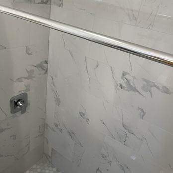 Amcor Construction - Before - old tub with chipped porcelain.  After - Walk in tile shower all new.  Thank you Aaron, Min and Kal! - General Contractors Near Me