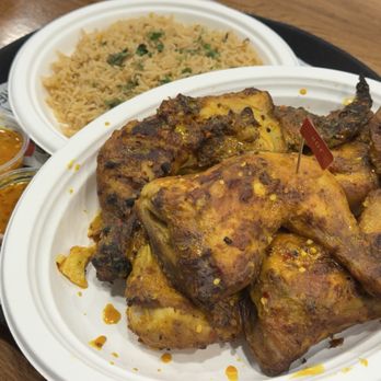 Peri Peri Original - Whole Flame Grilled Chicken (front), Seasoned Rice (back) - Chicken Shop Near Me - Rego Park, New York Peri Peri Original - Whole Flame Grilled Chicken (front), Seasoned Rice (back) - Chicken Shop Near Me - Rego Park, New York