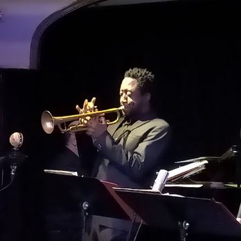 The Jazz Room - a man playing a trumpet - American Near Me - Waterloo, Ontario