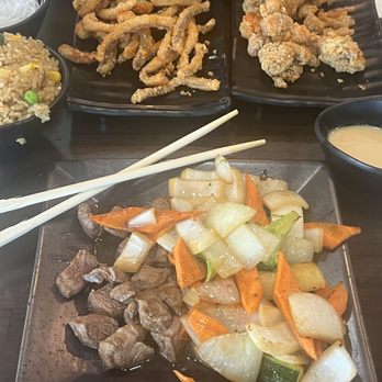 Tasty Pot - Aftermath of my plate, couldn't finish, calamari, basil chicken, friend rice, filet mignon, and veggies - Hot Pot Near Me - Reno, Nevada