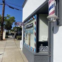 Coast Barber Shop - Front of shop looking towards the ocean. Parking lot is right in back