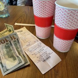The paper cups and bill we were given when we were asked to leave after 5 minutes of sitting down.