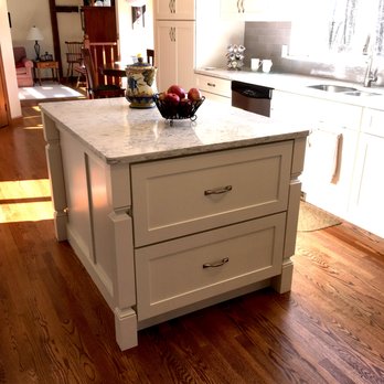 Kopilak Homes LLC - a kitchen island with a bowl of fruit on it - Cabinetry Near Me Kopilak Homes LLC - a kitchen island with a bowl of fruit on it - Cabinetry Near Me