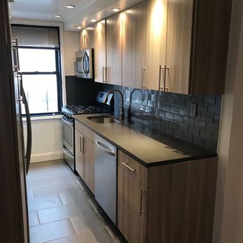 Metropolitan Remodeling Corp - a kitchen with stainless steel appliances - Flooring Near Me - New York, New York Metropolitan Remodeling Corp - a kitchen with stainless steel appliances - Flooring Near Me - New York, New York