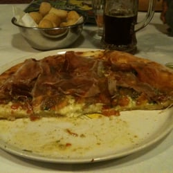 Pizzeria Toula' - Pizza with 3 cheeses, tomato, garlic, pesto and bresaola.