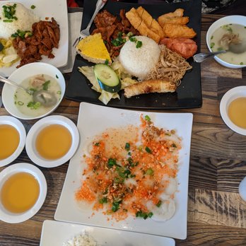 King Com Tam - Very full table - com tam bo nuong, com tam king special, banh beo tom chay, and lots of fish sauce. - Vietnamese Near Me - San Gabriel, California King Com Tam - Very full table - com tam bo nuong, com tam king special, banh beo tom chay, and lots of fish sauce. - Vietnamese Near Me - San Gabriel, California