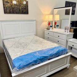 Affordable Home Furniture - Elegant white bedroom set with dresser and mirror.