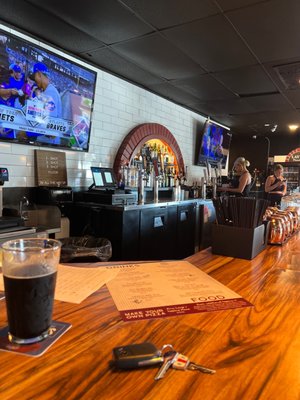 Photo of PJ SPORTS BAR - Moreno Valley, CA, US. a bar with a television and a pint of beer