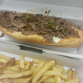 PepperJax Grill - Philly Cheesesteak with side of fries - Cheesesteaks Near Me - Cedar Rapids, Iowa