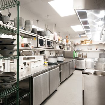 Flooring Solutions - a commercial kitchen with stainless steel appliances - Flooring Near Me - Livermore, California Flooring Solutions - a commercial kitchen with stainless steel appliances - Flooring Near Me - Livermore, California