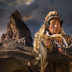 Monument Valley Safari - Don Mose, Navajo guide posing in front of El Capitan on a custom photography tour. Monument Valley Safari Tours. Book your tour today!