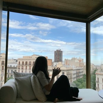Almanac - window seat in hotel room overlooking the streets of barcelona - Hotels Near Me - Barcelona, B