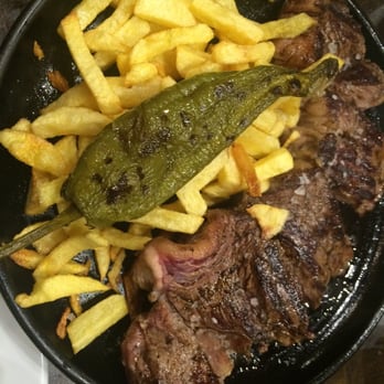Alhambra - Awesome steak, frites and green pepper. The steak comes out sizzling and medium rare. - Spanish Near Me - Madrid, M Alhambra - Awesome steak, frites and green pepper. The steak comes out sizzling and medium rare. - Spanish Near Me - Madrid, M