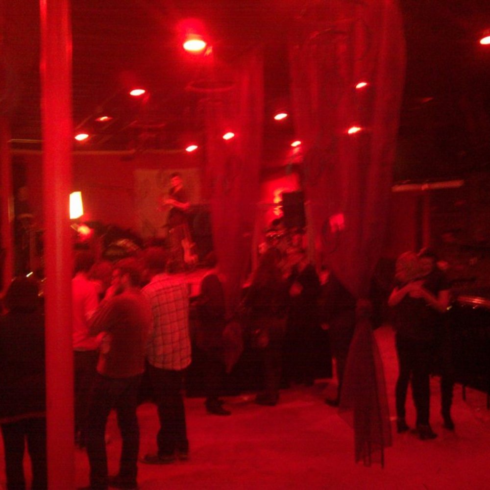 TV Lounge - a group of people standing in a dimly lit room - Bars Near Me - Detroit, Michigan TV Lounge - a group of people standing in a dimly lit room - Bars Near Me - Detroit, Michigan