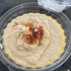 Leon International Foods - Hummus with white fungus on it indicating this is not fresh.