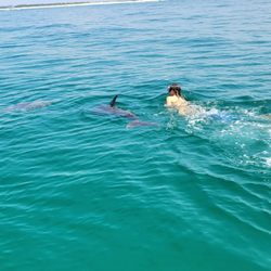 Water Planet - One of our girls in close with the dolphins.