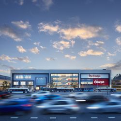Kings Plaza Shopping Center - Exterior of Kings Plaza with Primark, Burlington and Target as traffic passes.