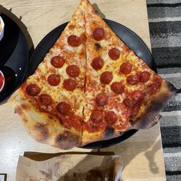 Pepperoni pizza slices Pepperoni pizza slices