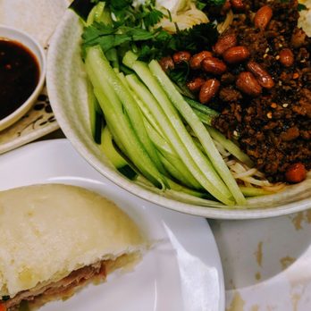 Happy Bao's - Dan Dan Noodles and half of a giant bao - Chinese Near Me - Mesa, Arizona Happy Bao's - Dan Dan Noodles and half of a giant bao - Chinese Near Me - Mesa, Arizona