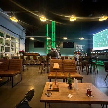 The Village Well - High top tables, low community tables, couches, bar seating - Sports Bars Near Me - Reno, Nevada