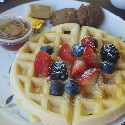 Waffles with fresh berries and imitation maple syrup. Waffles with fresh berries and imitation maple syrup.