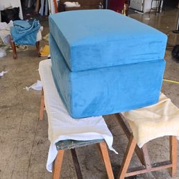 Ottoman being recovered in peacock microfiber.