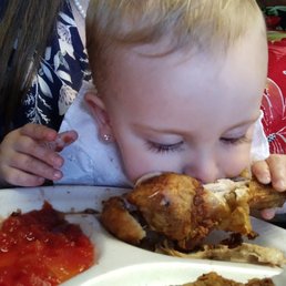 Our daughter stealing the fried chicken from us! Our daughter stealing the fried chicken from us!