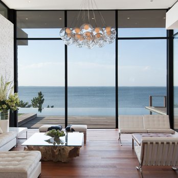 Phil Kouffman Builder - a living room with a view of the ocean - General Contractors Near Me - East Hampton, New York Phil Kouffman Builder - a living room with a view of the ocean - General Contractors Near Me - East Hampton, New York
