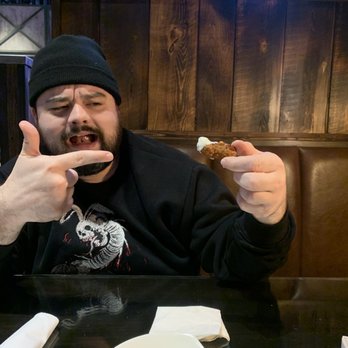 CraftHouse - Cool guy eating a ranch covered jalapeño cheese curd - Beer Bar Near Me - Rochester, Washington
