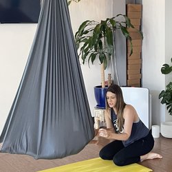 Raga Yoga - Kaylee demonstrating aerial yoga to my toddler who thought he was going in for a nap instead