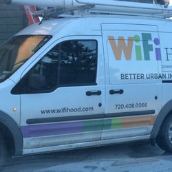 WiFiHood - 1 of 2 trucks completely blocking a alley.