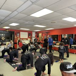 Guila's Hawaiian Kajukenbo Kickboxing - Students waiting for belt promotion.