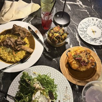 Huncho House - Grilled branzino, short beef ribs, oxtail Mac and brussel sprouts - New American Near Me - Hyattsville, Maryland