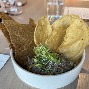 Owamni - Bean dip with fresh corn and wild rice cracker - New American Near Me - Minneapolis, Minnesota