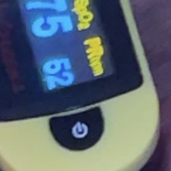 Highland Park Emergency Room - Pulse oxygen meter reading 75 spO2 and 52bpm