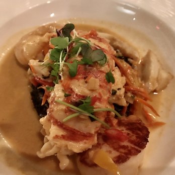 Sage - Thai Bouillabaisse of Lobster, Shrimp, Scallop and Fish in a Red Curry Coconut Sauce over Black Lotus Rice and Vegetables - New American Near Me - Sarasota, Florida Sage - Thai Bouillabaisse of Lobster, Shrimp, Scallop and Fish in a Red Curry Coconut Sauce over Black Lotus Rice and Vegetables - New American Near Me - Sarasota, Florida