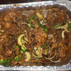 JC's 27th Street Stop - Fried Pork Chops Smothered with brown gravy and veggies