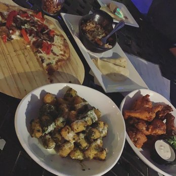 The Perch Brewery - Pesto goat cheese tots, DP pizza, wings and green chili pork with tortillas. - Gastropubs Near Me - Chandler, Arizona The Perch Brewery - Pesto goat cheese tots, DP pizza, wings and green chili pork with tortillas. - Gastropubs Near Me - Chandler, Arizona