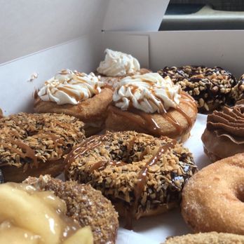Doughology - Lynbrook - 2 Samoa, 2 Snickers, 2 Churro, French Toast, Apple Crumb, Cinnamon Bun, Raspberry Nutella, Graham crumbs on vanilla; incorrect cinnamon. - Donuts Near Me - Lynbrook, New York