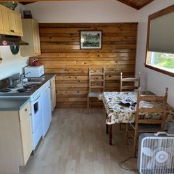 MainStay Cottages & RV Park - Kitchen area, set of 4 plates etc