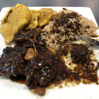 Cutlass Grille - Oxtail, rice and peas and tostones. You are going to love the sauce on that rice - Caribbean Near Me - Chesapeake, Virginia Cutlass Grille - Oxtail, rice and peas and tostones. You are going to love the sauce on that rice - Caribbean Near Me - Chesapeake, Virginia