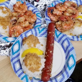 Giovanni’s Shrimp - Garlic shrimp scampi plates and garlic hot dog plate all with butter garlic topping on the rice!  Onolicious! - Seafood Near Me - Honolulu, Hawaii