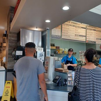 Jersey Mike's Subs - 8/04/24 Supposedly the area to pick-up orders, no sign. One of the 2 guys waiting for his mobile order - Fast Food Near Me - Pearl City, Hawaii Jersey Mike's Subs - 8/04/24 Supposedly the area to pick-up orders, no sign. One of the 2 guys waiting for his mobile order - Fast Food Near Me - Pearl City, Hawaii