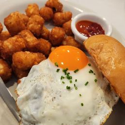 Burger with the sunniest side up egg