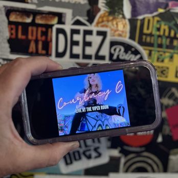 The Viper Room - a person holding a cell phone - Music Venues Near Me - West Hollywood, California The Viper Room - a person holding a cell phone - Music Venues Near Me - West Hollywood, California