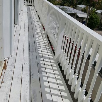 Alfonso Landscaping Enterprises - a porch with white railings - Landscaping Near Me - Key Largo, Florida